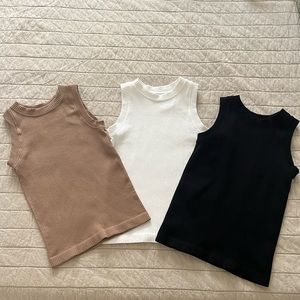 Three ribbed tanks
